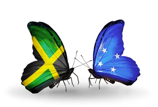 Vlinders met jamaica en micronesia vlaggen op vleugels — Stockfoto