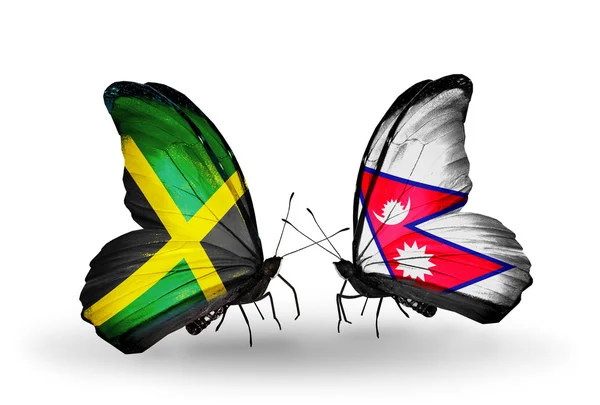 Butterflies with Jamaica and Nepal flags on wings — Stock Photo, Image
