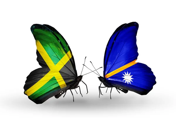 Papillons avec des drapeaux Jamaïque et Nauru sur les ailes — Photo