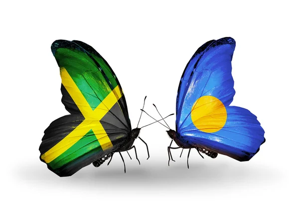 Butterflies with Jamaica and Palau flags on wings — Stock Photo, Image