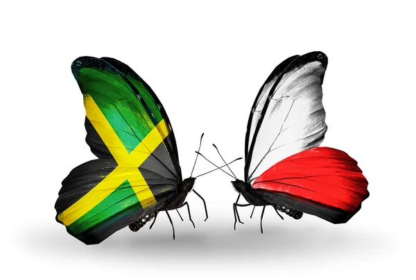 Butterflies with Jamaica and Poland flags on wings — Stock Photo, Image