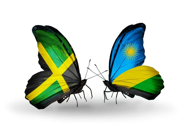 Papillons avec drapeaux Jamaïque et Rwanda sur les ailes — Photo