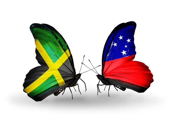 Papillons avec des drapeaux Jamaïque et Samoa sur les ailes — Photo