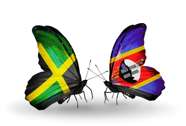 Papillons avec drapeaux Jamaïque et Swaziland sur les ailes — Photo