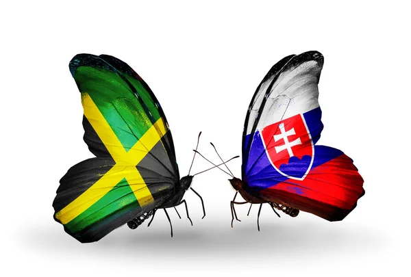 蝴蝶翅膀上的牙买加和斯洛伐克标志 — 图库照片