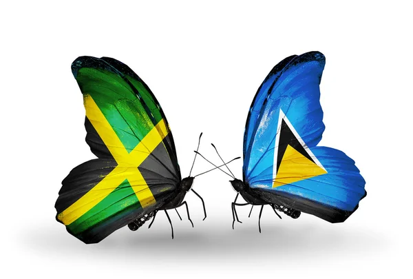 Papillons avec des drapeaux Jamaïque et Sainte-Lucie sur les ailes — Photo