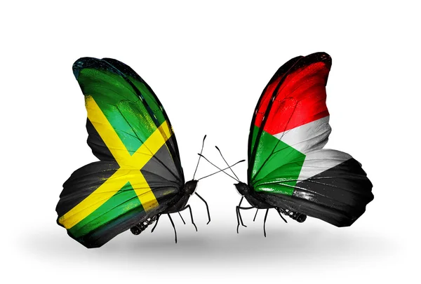 Mariposas con banderas de Jamaica y Sudán en alas — Foto de Stock