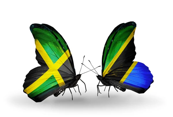 Farfalle con bandiere giamaicane e tanzaniane sulle ali — Foto Stock