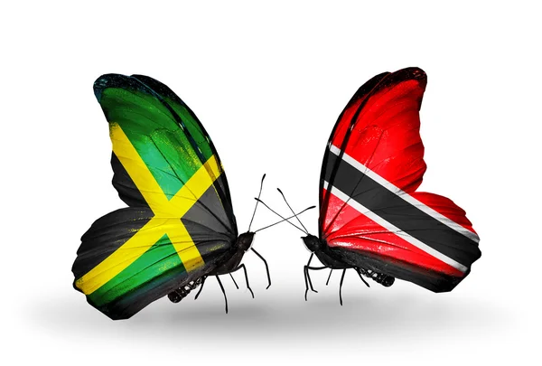 Butterflies with Jamaica and Trinidad and Tobago flags on wings — Stock Photo, Image