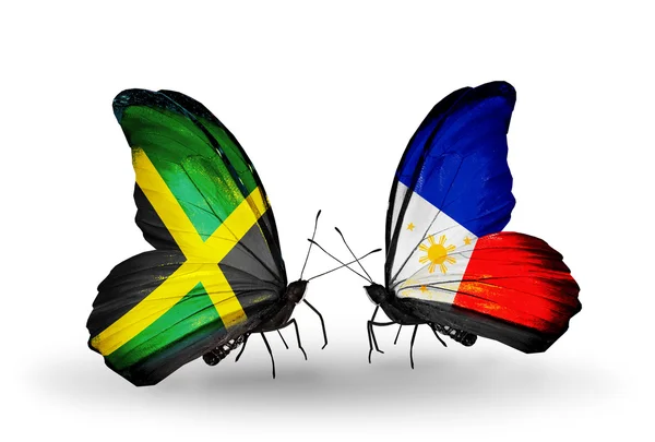 Papillons avec drapeaux Jamaïque et Philippines sur les ailes — Photo