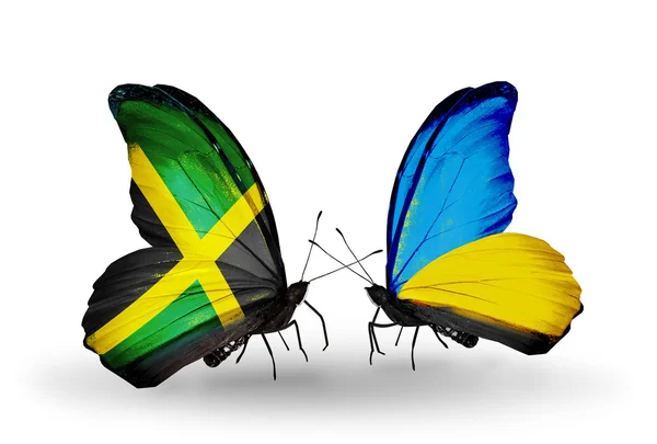 Butterflies with Jamaica and Ukraine flags on wings — Stock Photo, Image