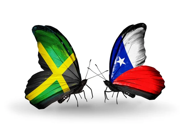 Butterflies with Jamaica and Chile flags on wings — Stock Photo, Image