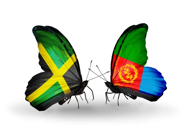 Butterflies with Jamaica and Eritrea flags on wings — Stock Photo, Image