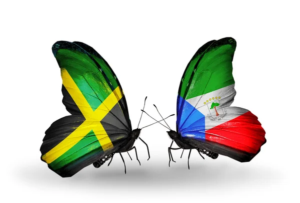 Mariposas con banderas de Jamaica y Guinea Ecuatorial en alas — Foto de Stock