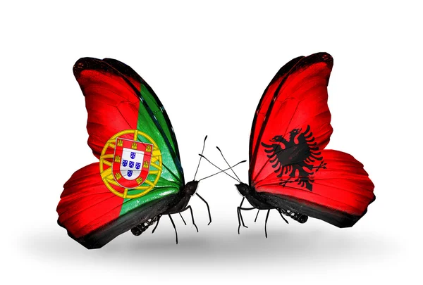 Butterflies with Portugal and Albania flags on wings — Stock Photo, Image