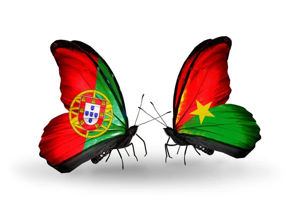 Borboletas com bandeiras de Portugal e Burkina Faso em asas — Fotografia de Stock