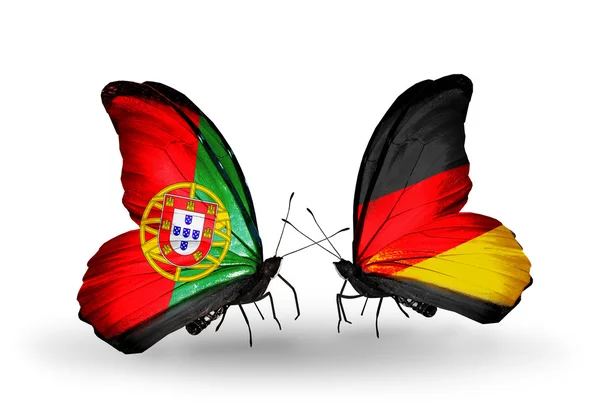 Motyle z Portugalii i Niemcy flagi na skrzydłach — Zdjęcie stockowe