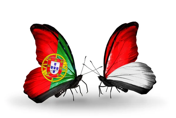 Portekiz ve monaco, Endonezya bayrakları kanatlar üzerinde kelebekler — Stok fotoğraf
