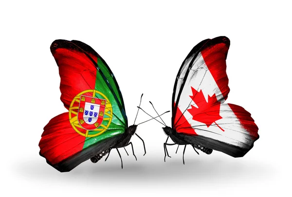 Motýli s Portugalskem a Kanada příznaky na křídlech — Stock fotografie