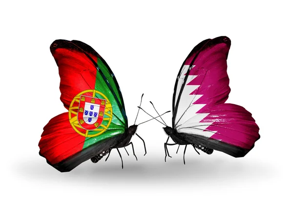 Butterflies with Portugal and Qatar flags on wings — Stock Photo, Image