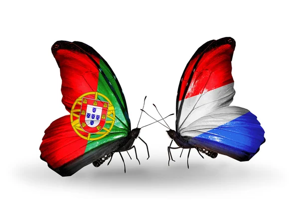 Butterflies with Portugal and Luxembourg flags on wings — Stock Photo, Image