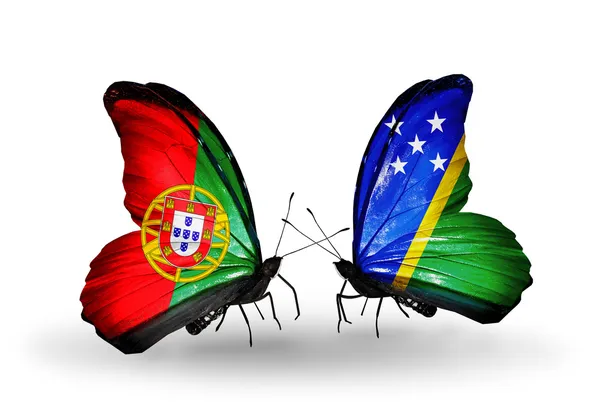 Butterflies with Portugal and Solomon Islands flags on wings — Stock Photo, Image