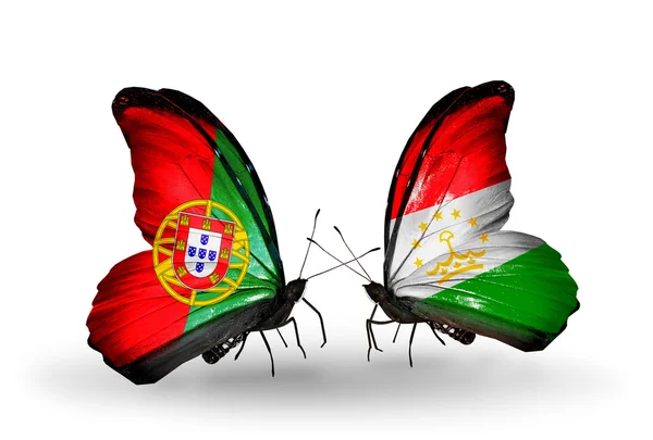 Borboletas com bandeiras de Portugal e Tajiquistão em asas — Fotografia de Stock