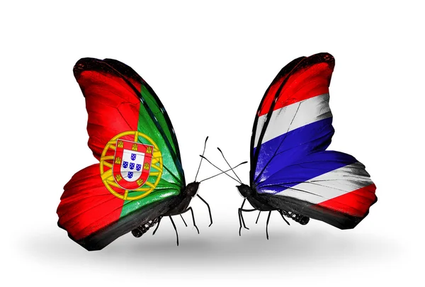 Butterflies with Portugal and Thailand flags on wings — Stock Photo, Image