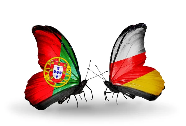 Motyle z Portugalii i Południowej Osetii flagi na skrzydłach — Zdjęcie stockowe