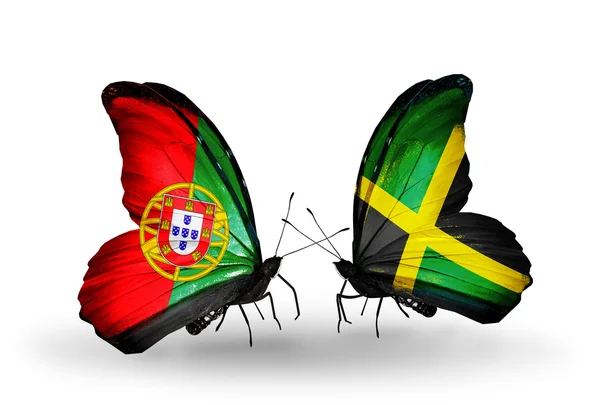 Schmetterlinge mit portugiesischen und jamaikanischen Flaggen auf Flügeln — Stockfoto