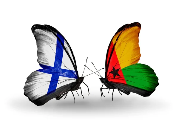 Mariposas con banderas de Finlandia y Guinea Bissau en alas —  Fotos de Stock