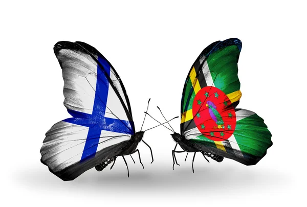 Бабочки с флагами Финляндии и Доминики на крыльях — стоковое фото