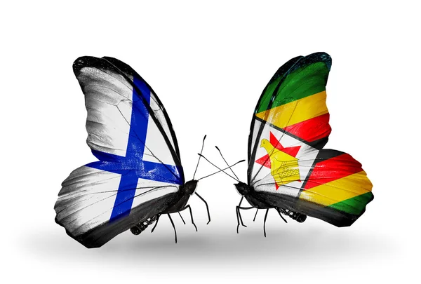 Borboletas com bandeiras da Finlândia e Zimbábue em asas — Fotografia de Stock