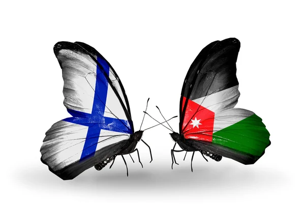 Butterflies with Finland and Jordan flags on wings — Stock Photo, Image