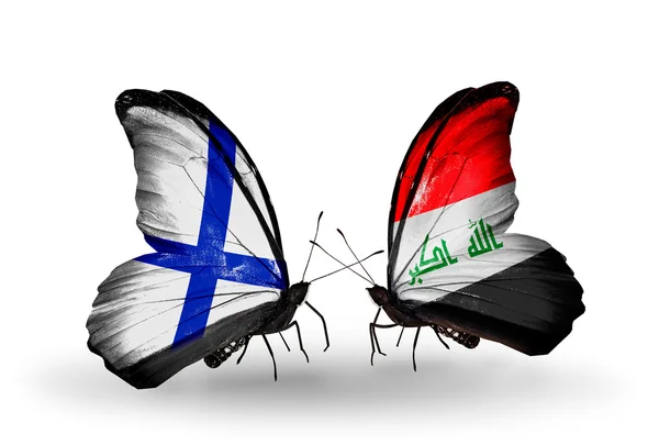 Butterflies with Finland and Iraq flags on wings — Stock Photo, Image