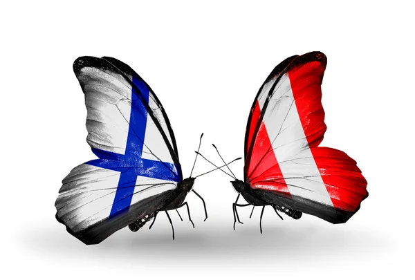 Motyle z Finlandii i peru flagi na skrzydłach — Zdjęcie stockowe
