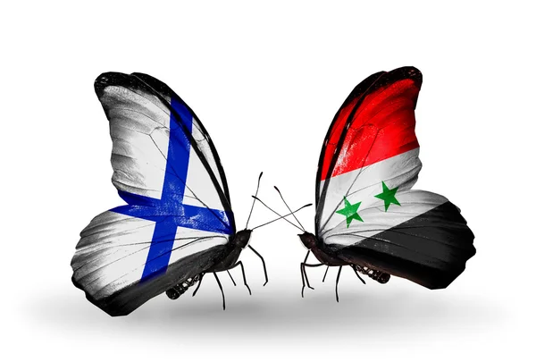 Mariposas con banderas de Finlandia y Siria en alas — Foto de Stock