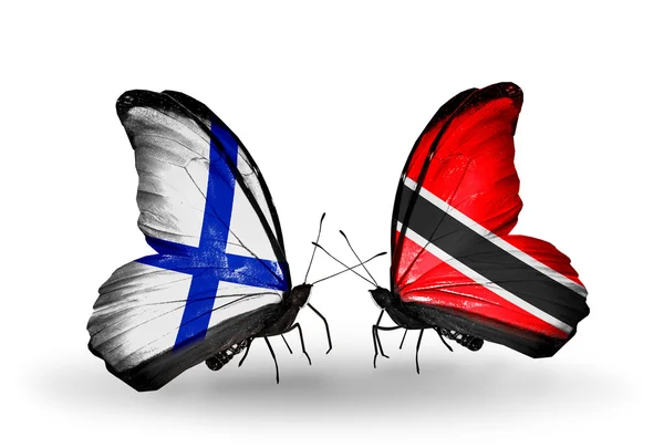 Farfalle con bandiere Finlandia e Tobago sulle ali — Foto Stock