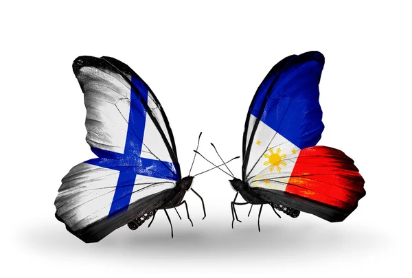 Butterflies with Finland and Philippines flags on wings — Stock Photo, Image