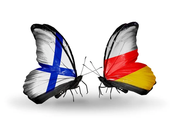 Butterflies with Finland and South Ossetia flags on wings — Stock Photo, Image