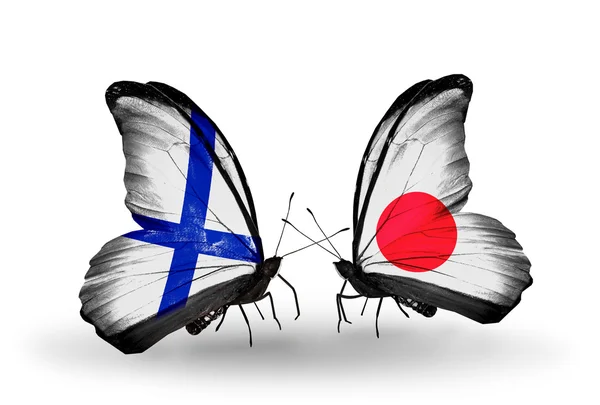 Borboletas com bandeiras da Finlândia e do Japão em asas — Fotografia de Stock