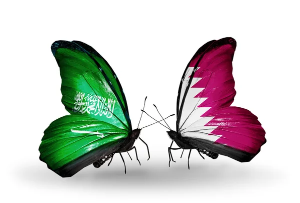Vlinders met Saoedi-Arabië en qatar vlaggen op vleugels — Stockfoto