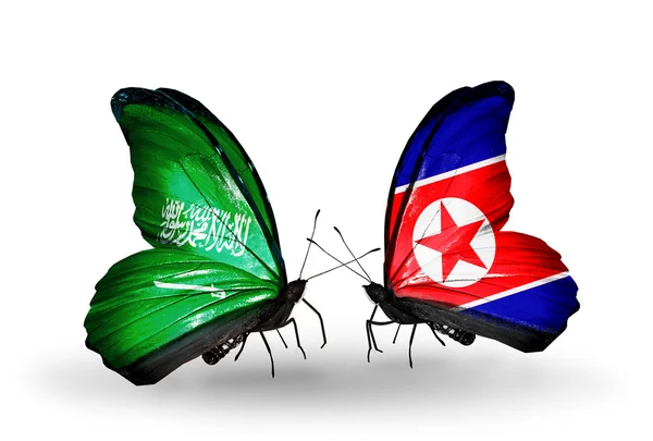 Mariposas con banderas de Arabia Saudita y Corea del Norte en alas — Foto de Stock