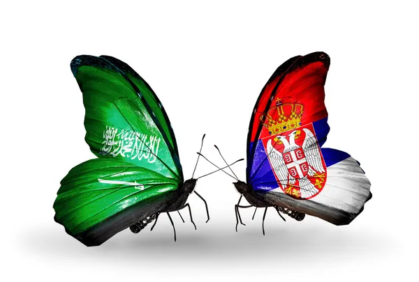 与沙特阿拉伯和塞尔维亚国旗上的翅膀的蝴蝶 — 图库照片