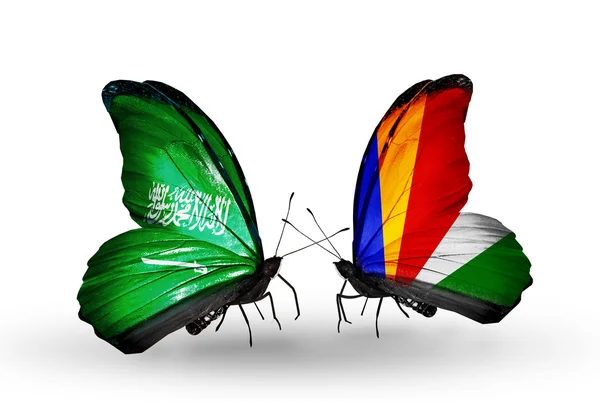 Motýli se Saúdskou Arábií a Seychely vlajek na křídlech — Stock fotografie