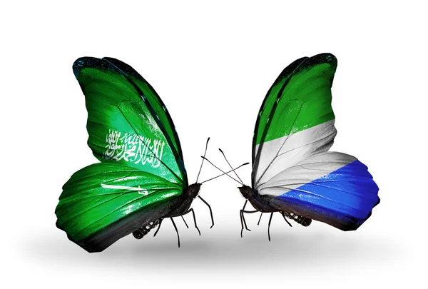 Papillons avec des drapeaux Arabie Saoudite et Leone sur les ailes — Photo