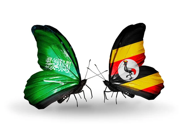 Butterflies with Saudi Arabia and Uganda flags on wings — Stock Photo, Image