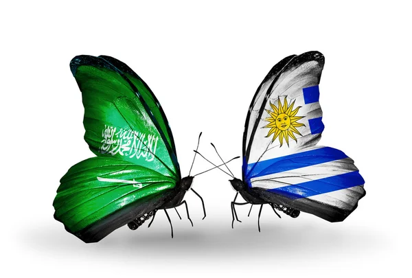 Butterflies with Saudi Arabia and Uruguay flags on wings — Stock Photo, Image