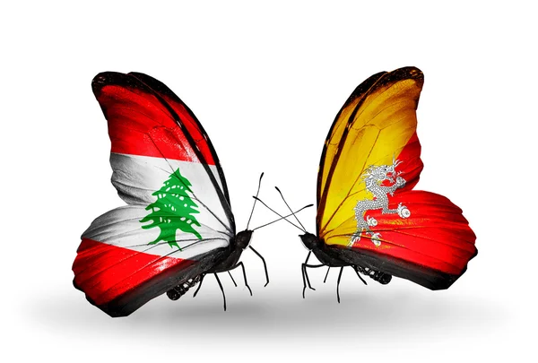 Vlinders met Libanon en bhutan vlaggen op vleugels — Stockfoto