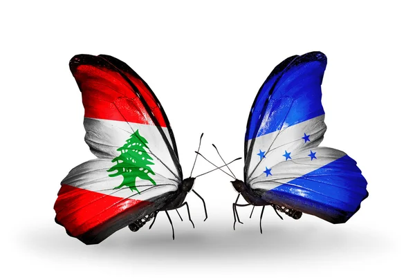 Papillons avec drapeaux du Liban et du Honduras sur les ailes — Photo